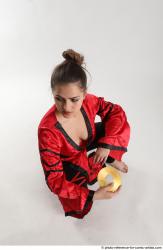 Woman Adult Average Martial art Sitting poses Coat Latino